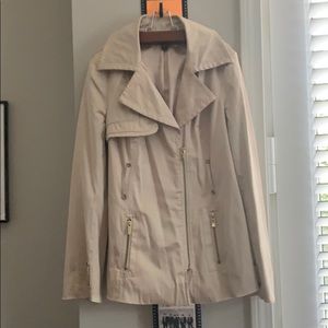 Bebe , lightly worn, gold tan in color